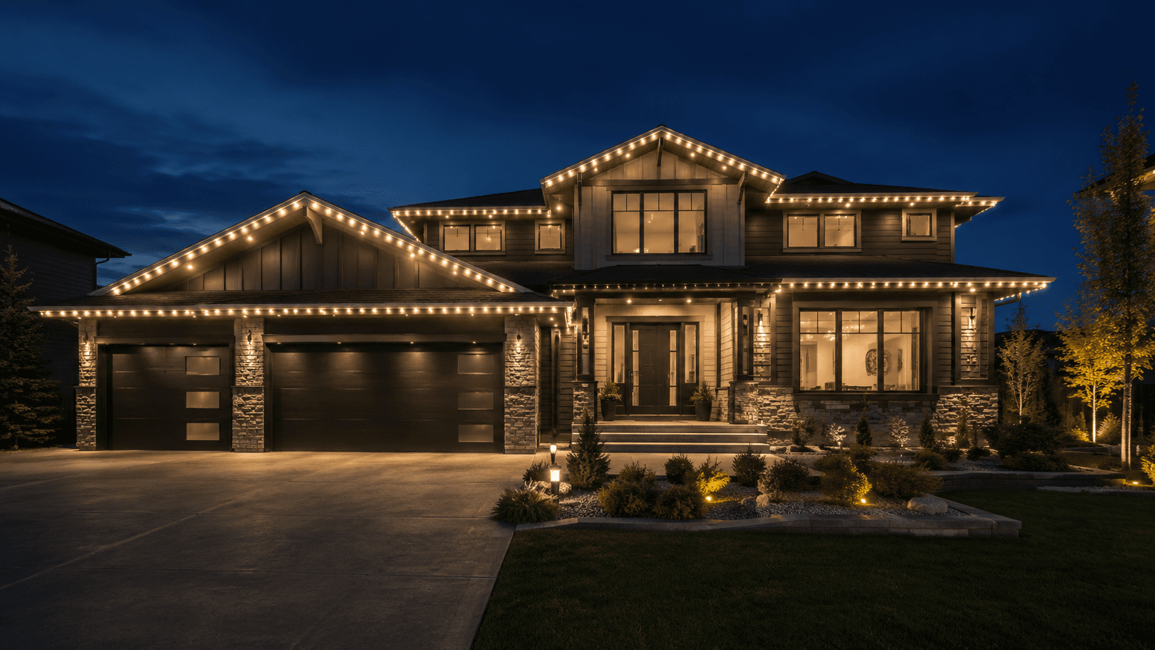 Modern Edmonton home with professional Christmas roofline lighting and permanent soffit lighting
